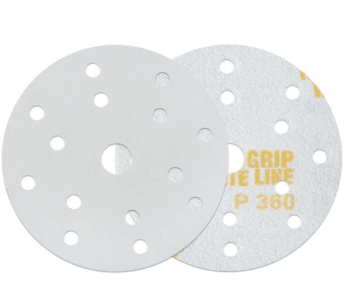 Two circular sandpaper discs with multiple holes, one showing printed text and the other plain white.